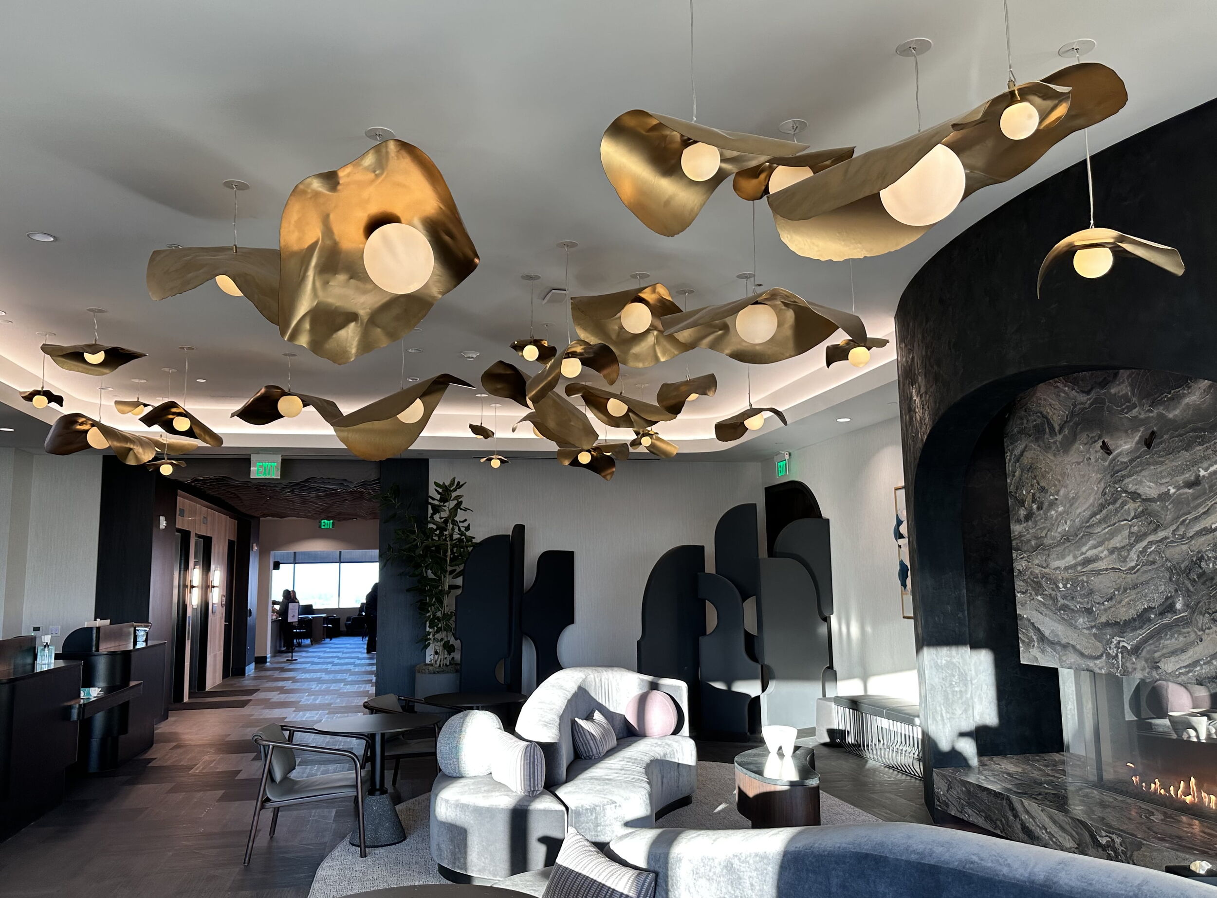 Luxury Lounge With Gold Chandeliers And Marble Fireplace