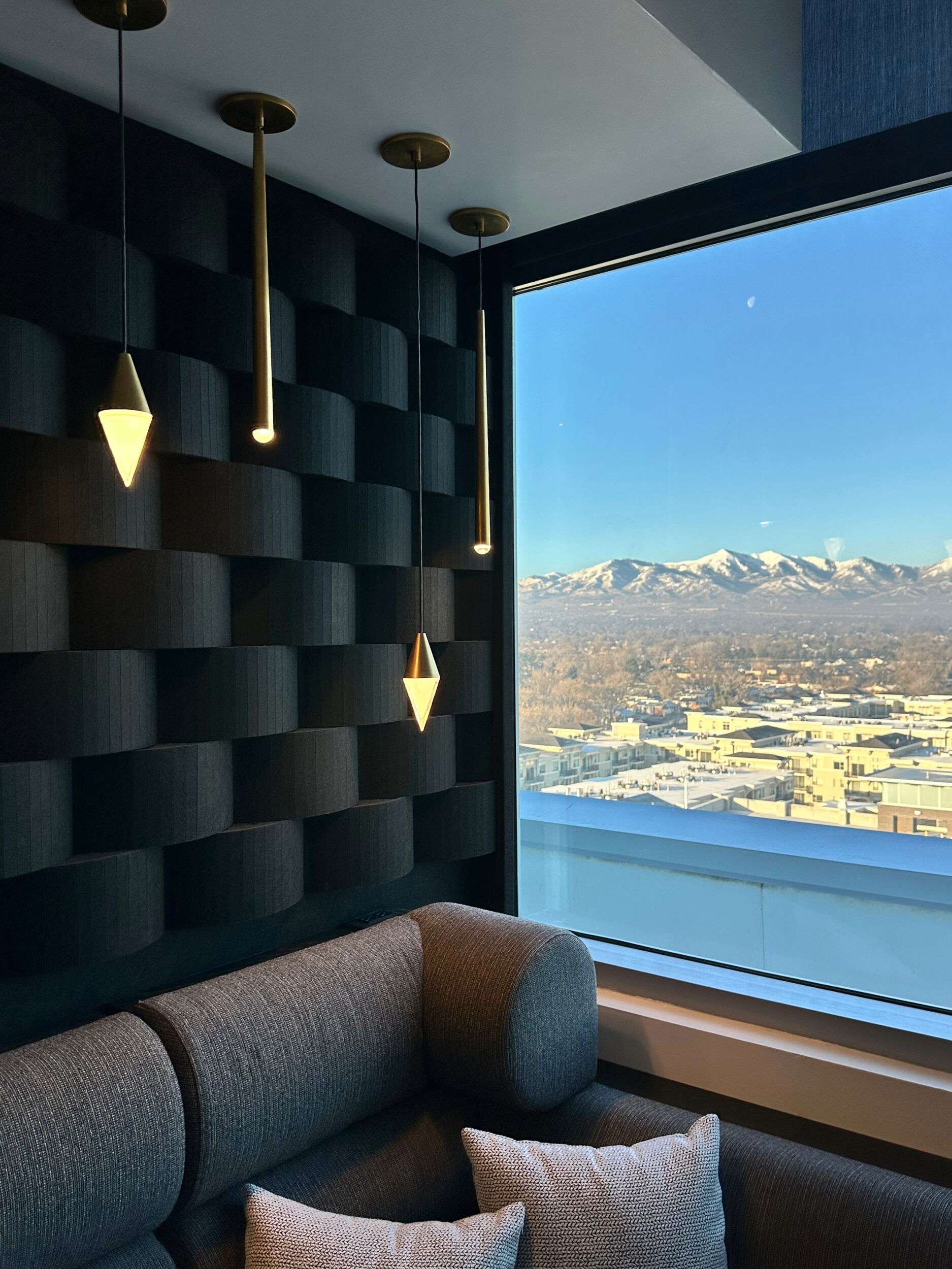 Modern Room Interior with Stylish Pendant Lights and a View of Snow-Capped Mountains