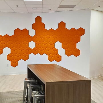 Modern Office with Geometric Orange Wall Art, Contemporary Furniture, and Wood Accents