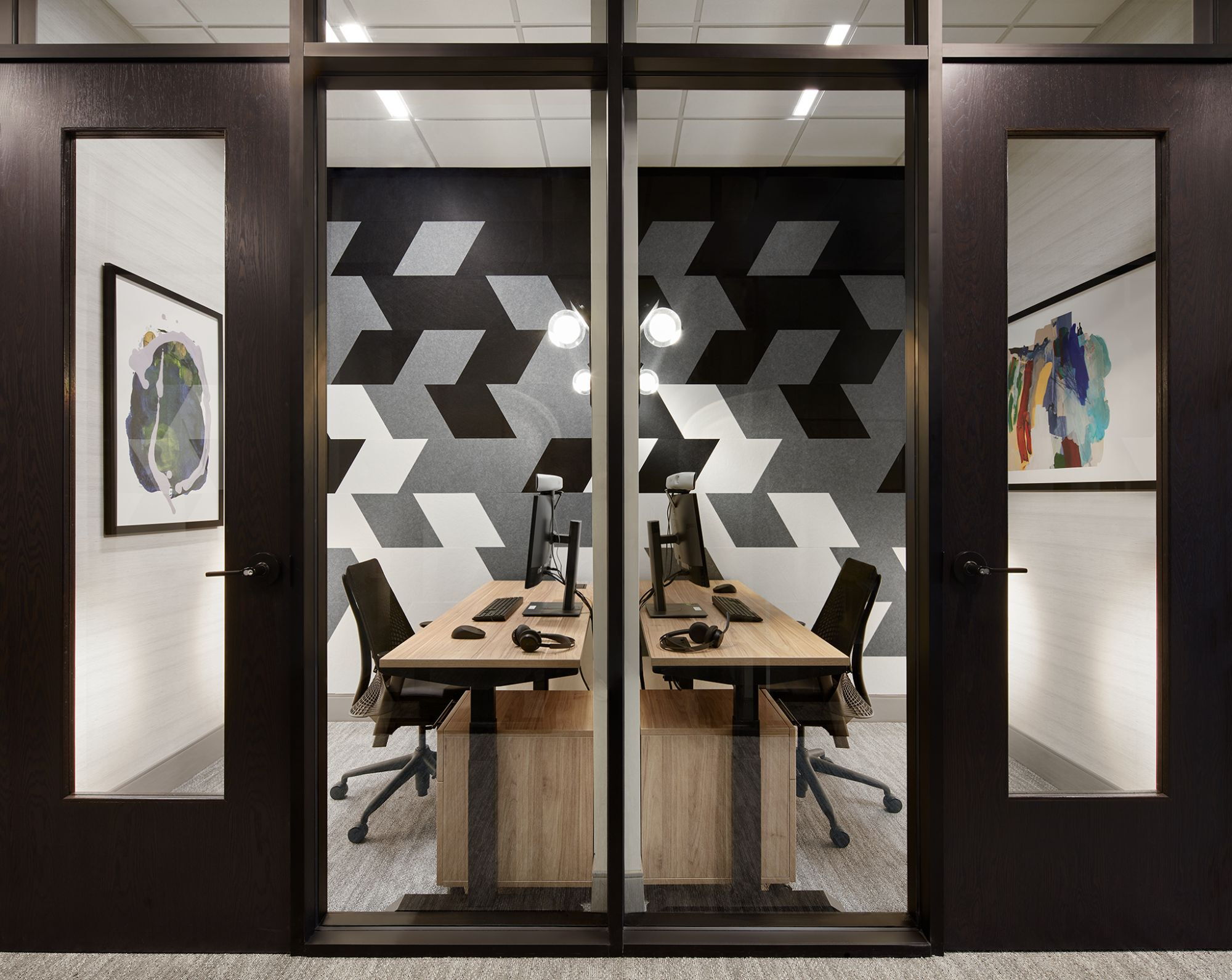 Modern Office Meeting Room with Geometric Wall Design and Artistic Decor