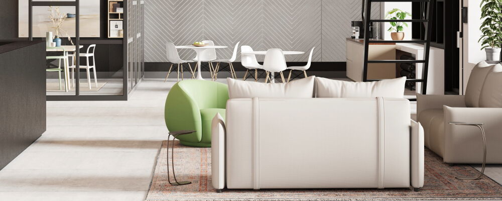 Spacious Modern Office Featuring Red Accents, Comfortable Seating, and Open Layout